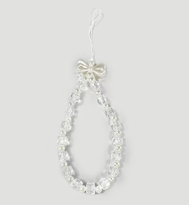 📱 Bijou de téléphone – Perles transparentes et blanches avec nœud papillon 🎀